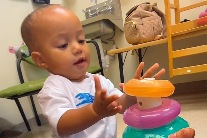 an infant stacking rings