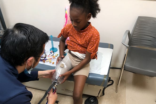 a child being fitted for a prosthetic