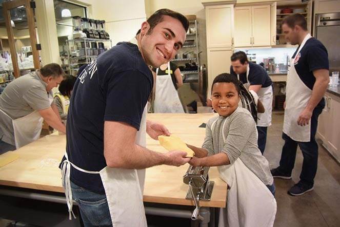 burn patient and firefighter baking cookies