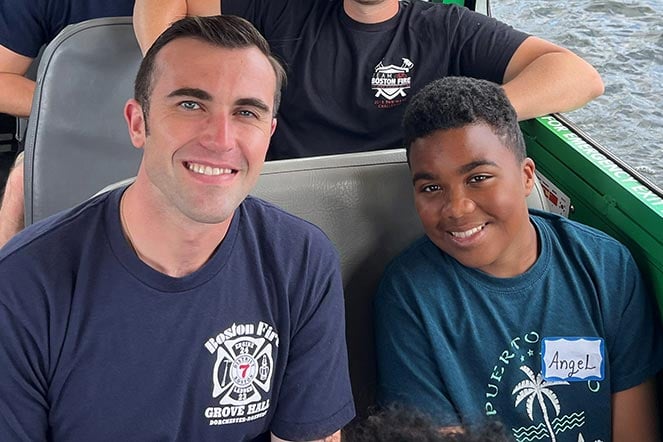 burn patient with firefighter on boat