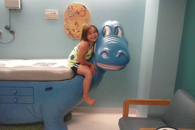 young female burn patient in exam room