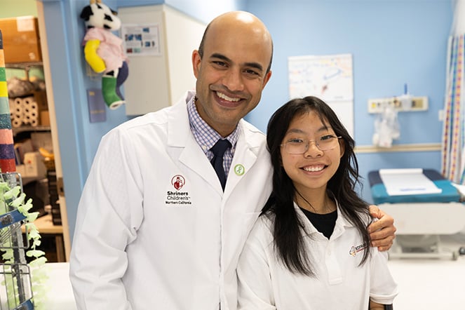 a child smiling with a doctor