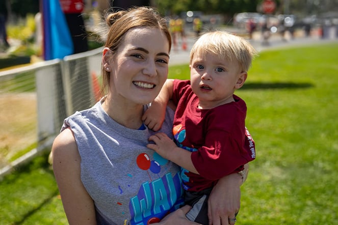 an adult woman holding an infant