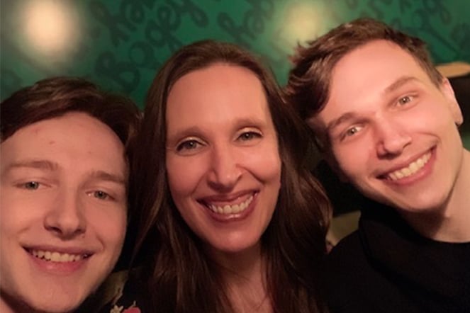 a selfie of a woman and two teenage boys