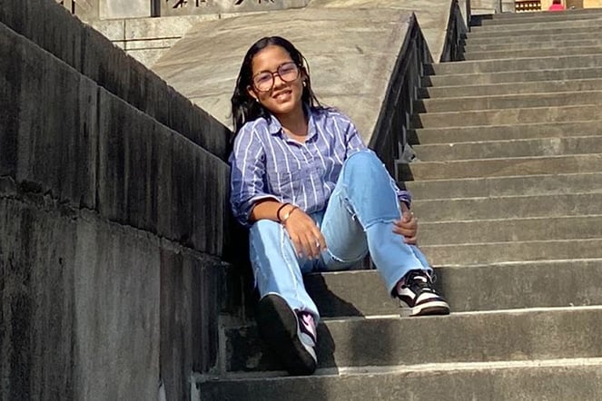a child sitting on concrete steps