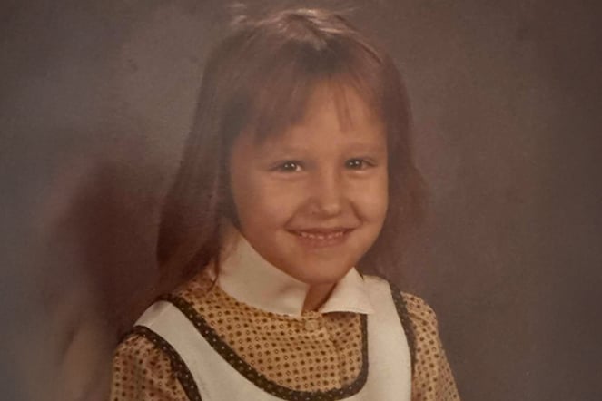 an aged portrait photo of a child