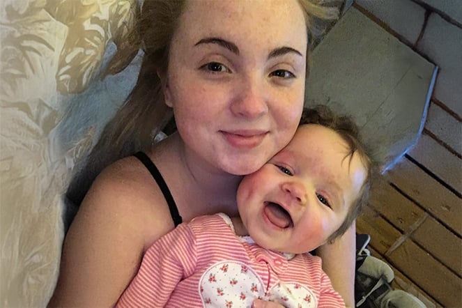 a mother holding an infant