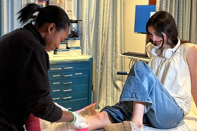 a provider removes the cast of a smiling teenager