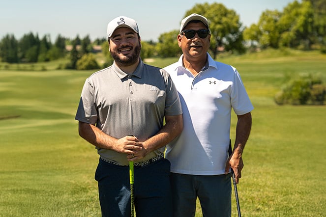 two golfers on a golf course