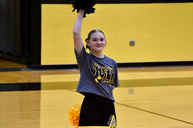a cheerleader at a basketball game