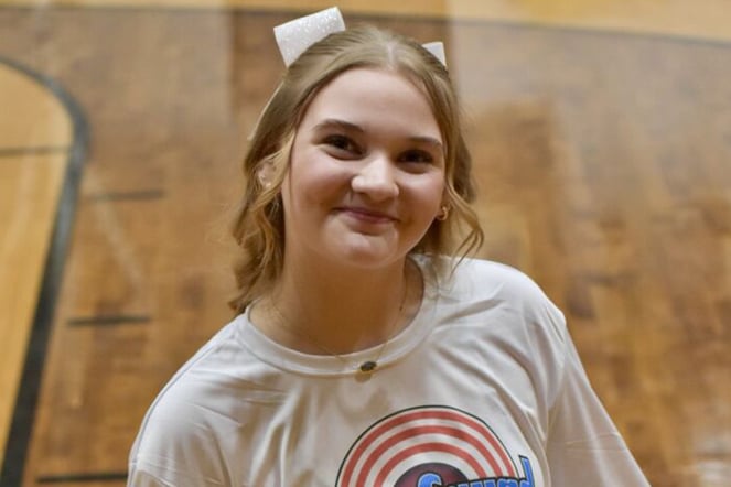 a teenager with a bow in her hair