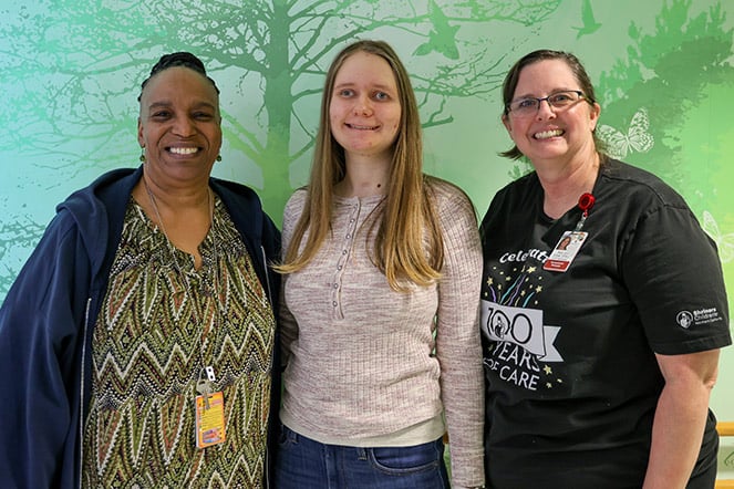 a teenager with two women