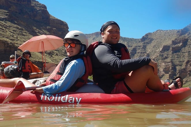 two campers on a raft