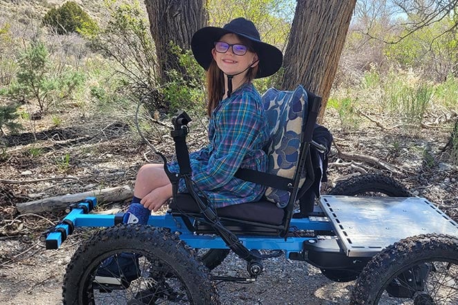 a child sitting on a four wheeler