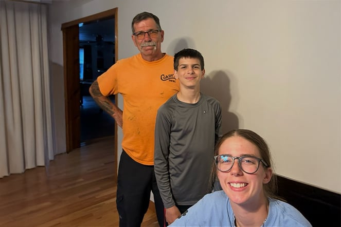 a selfie photo of a father, son, and daughter