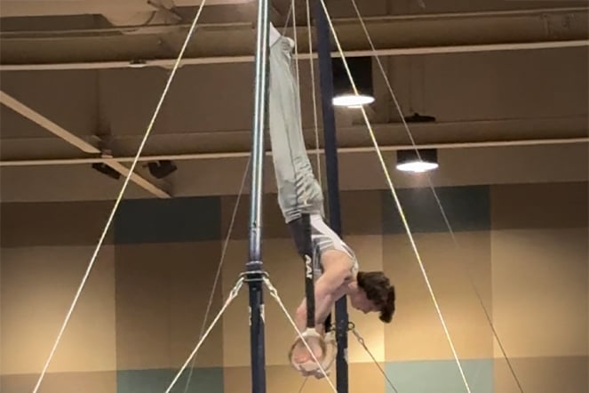 a gymnast performing on the rings