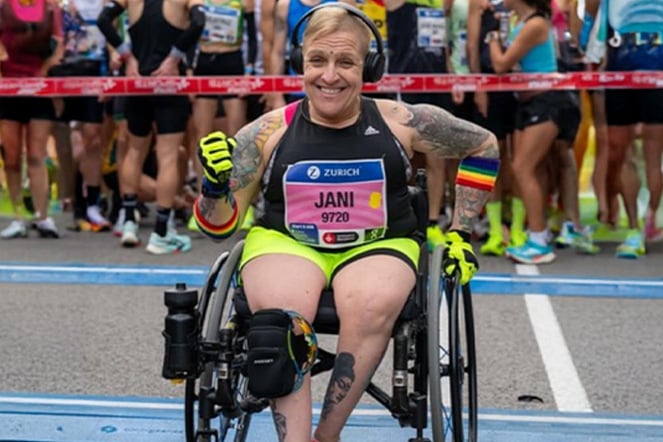 a woman in a wheelchair preparing to race in a marathon