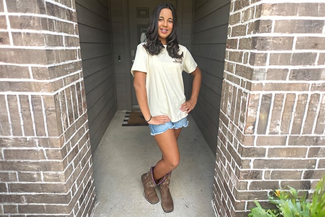 a teenager in cowboy boots