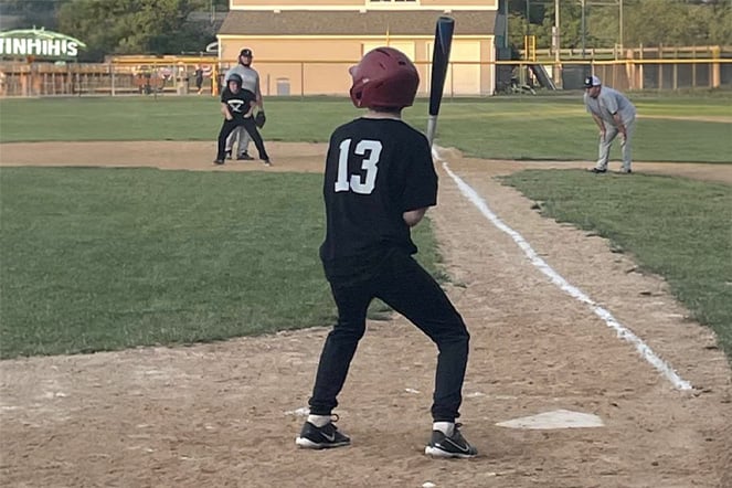 a baseball player preparing to swing his bat