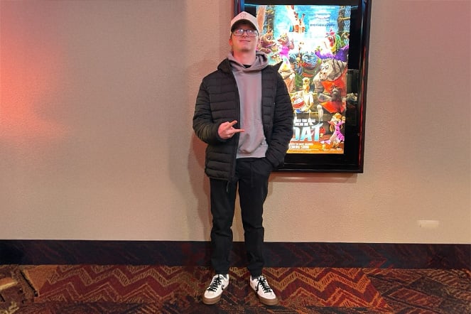 a teen in the lobby of a movie theater
