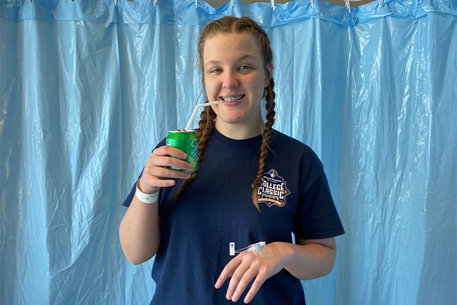 a child drinking a soda