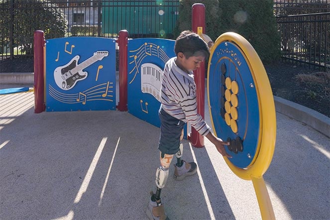 prosthetics patient on playground
