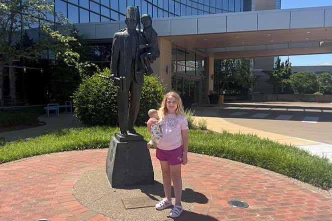 Teagan in front of medical center