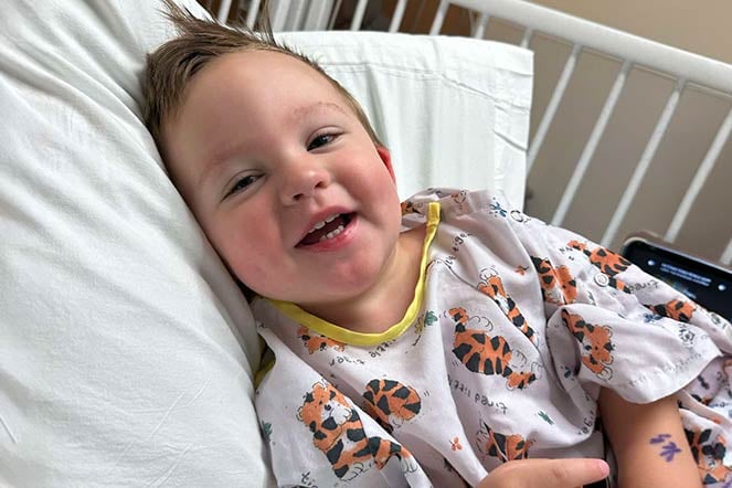 orthopedic patient smiling in hospital bed