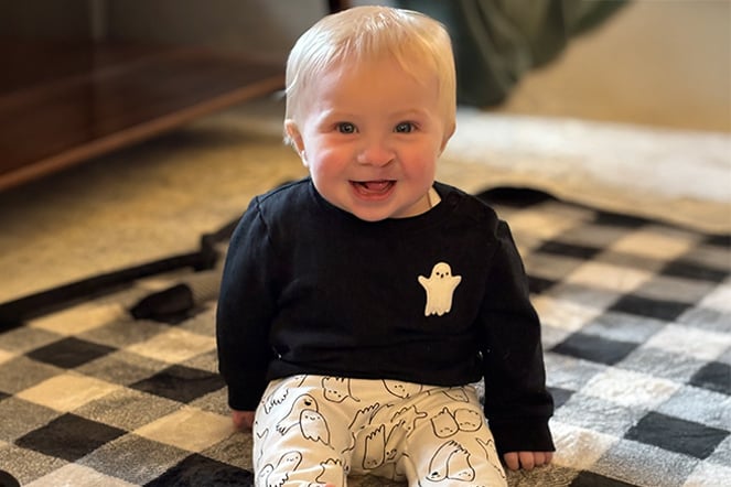 a child sitting on a blanket