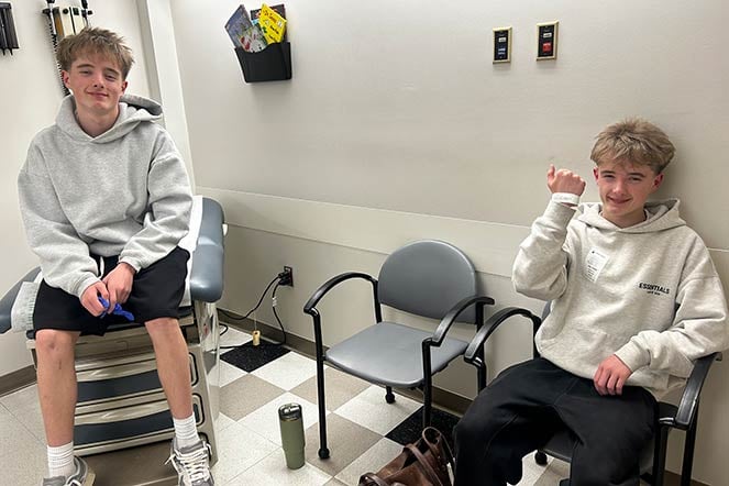 twin sports medicine patients wait in exam room