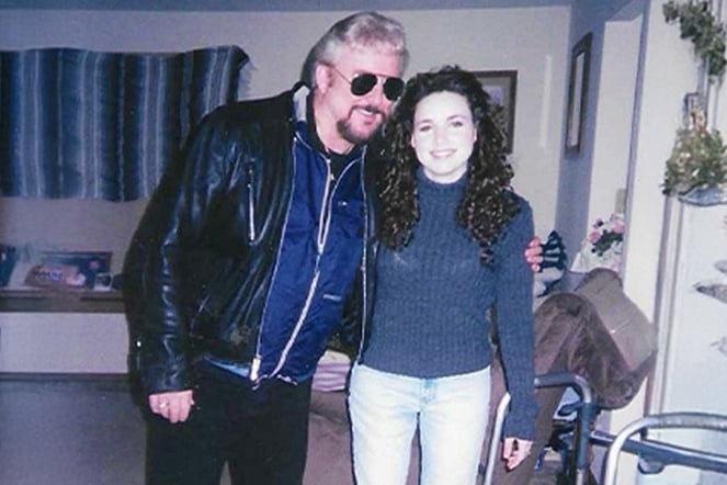 a man and woman sharing a side-hug