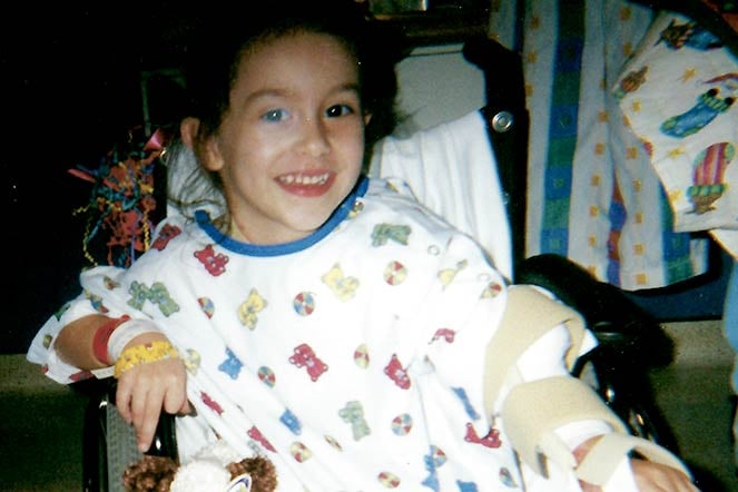 young burn patient in wheelchair