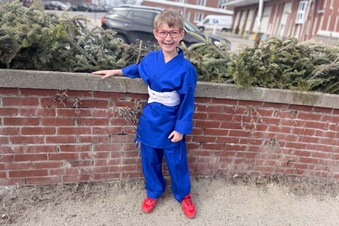 burn patient outside wearing karate uniform