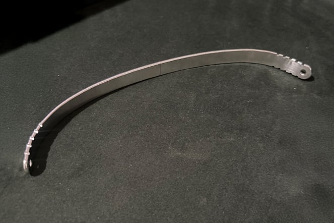 a curved titanium bar