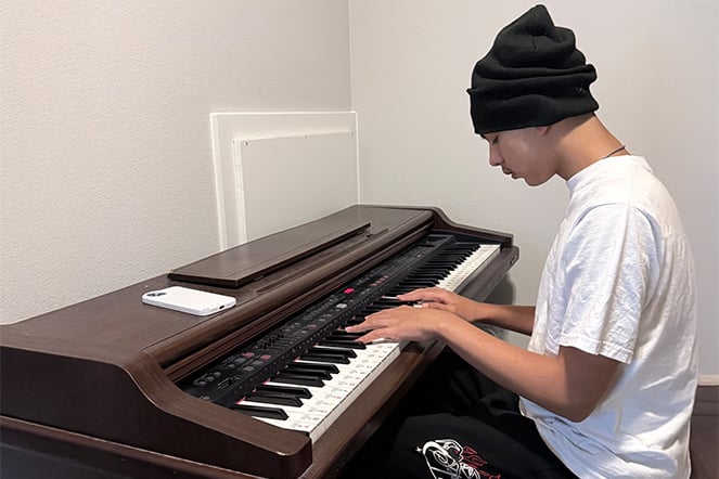 a child playing a keyboard