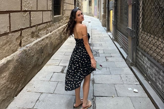 female toe walking patient wearing dress