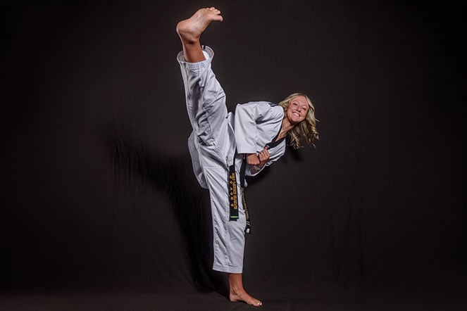 scoliosis patient performs a taekwondo high kick