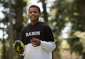 boy holding a football