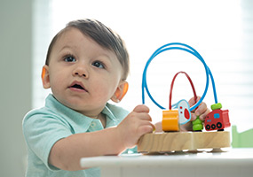 male patient playing with child's toy