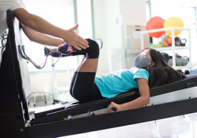 patient during prosthetic leg therapy session