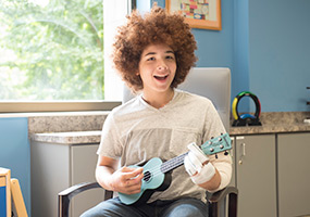 patient playing ukelele