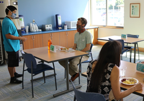 staff and patient in cafeteria