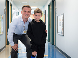 patient with prosthetic leg poses with provider