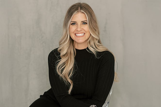 a portrait of a woman in a black dress