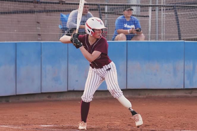 Ali at bat on softball field