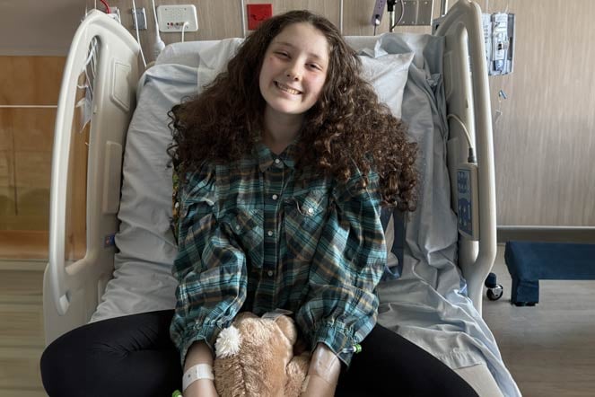 orthopedic patient Alysa in hospital bed