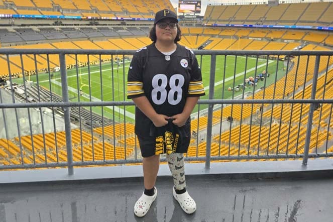 orthopedic patient Carlos inside football stadium