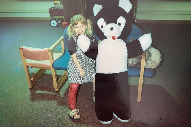 patient in cast with oversized kitten stuffed animal