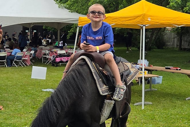 A child riding a horse