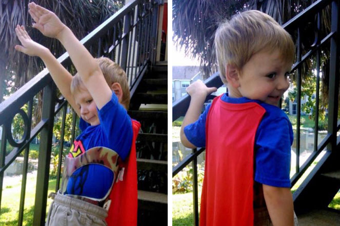 Clayton wearing costume with cape